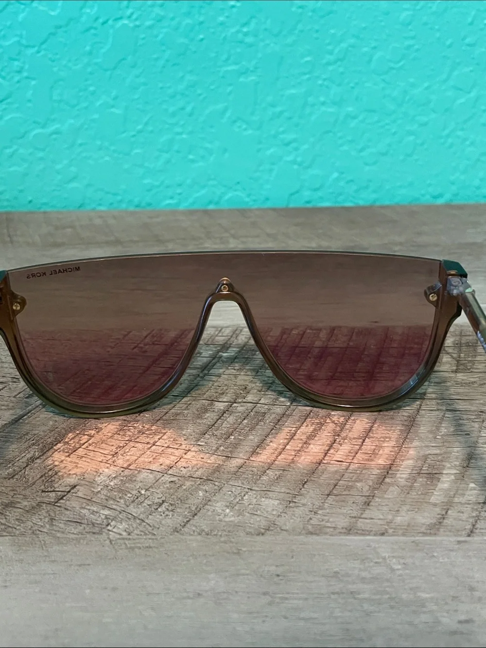 Michael Kors Unisex MK2151 Aspen Amber Rimless Shield Sunglasses